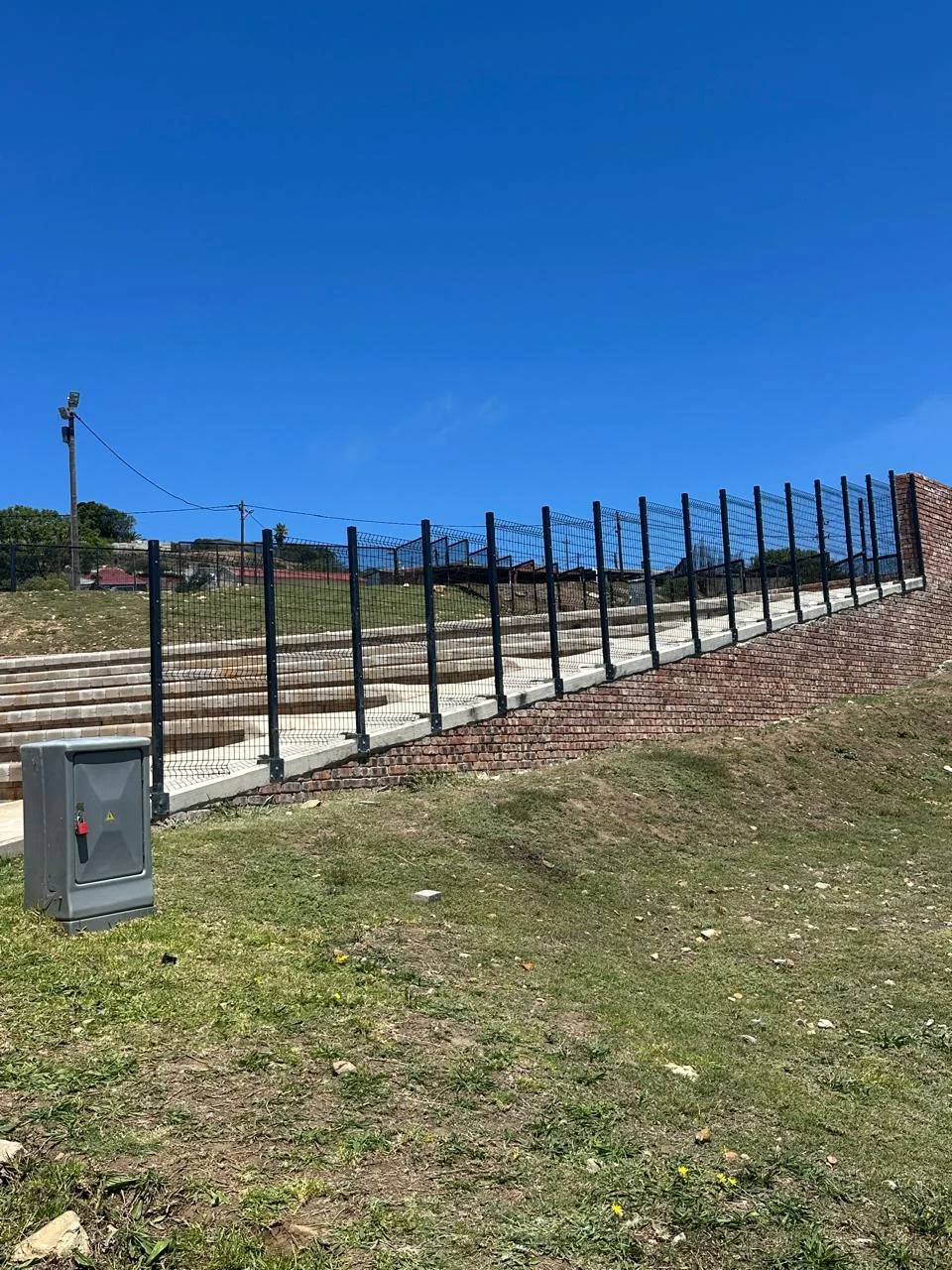 Close-up of a matte black powder coated steel fence panel